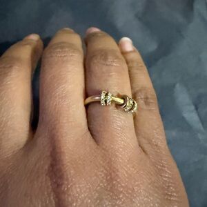 Elegant 18k gold ring featuring delicate diamonds rings.